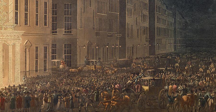 A street of Georgian London, filled with people and carriages enjoying a public illumination. Stretching into the distance, the street is lit by gas lamps.