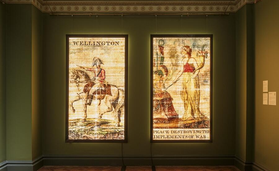 The two transparencies, Wellington to the left and Peace to the right, on lightboxes in the Foyle Space.