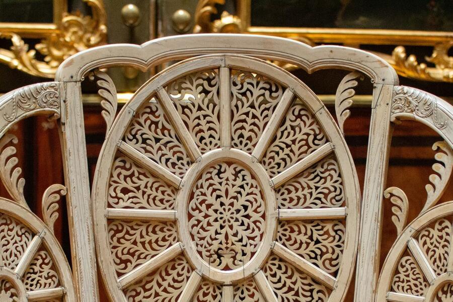 Details of the back of one of the ivory chairs in the Picture Room.