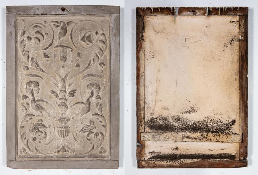 The front and reverse of a cast before restoration, depicting a relief of floral patterns.