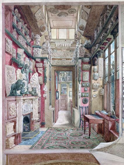 View of the Little Study, 13 Lincoln’s Inn Fields. The room is a small room with fragments of architecture hung on the walls densely