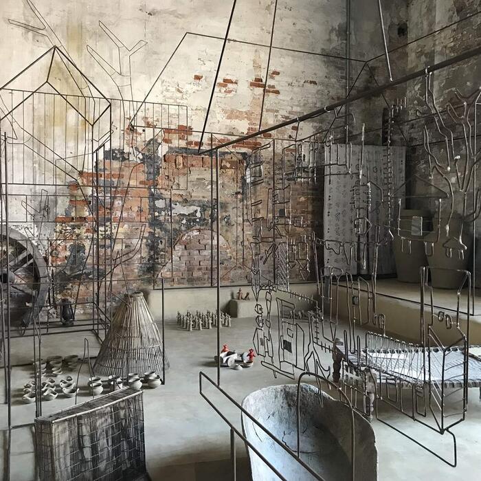 An art installation in a brick room.