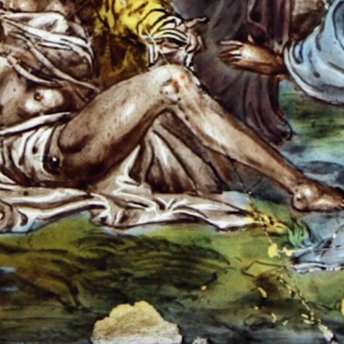 A detail of the 'Raising of Lazarus' stained glass panel in the recess showing green colouring