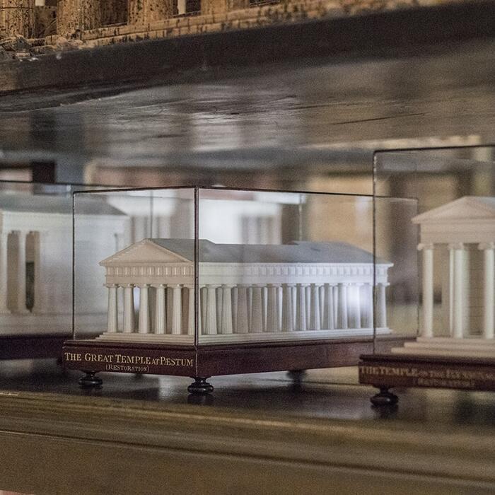 Three of Fouquet's models, made from plaster of paris and encased in glass cases