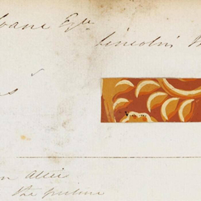 A sample of the wallpaper from Soane's day showing its bright red and gold colouring