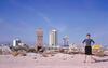 Photograph of Denise Scott Brown standing in front of the Las Vegas strip