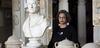 A photograph of Marina Tabassum with a bust of Sir John Soane