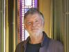 Architect Peter Barber standing near the window of the South Drawing Room at Sir John Soane's Museum.