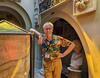 Valentino, a volunteer at the Soane Museum, stands next to the Sarcophagus of Seti I.