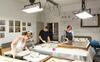Photograph of our Conservation team working on objects in the new purpose-built conservation studio