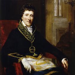 A portrait of Soane, sat in a chair, wearing his Masonic robes.