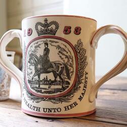 A large tankard marking the coronation of the young Queen Elizabeth II in 1953.