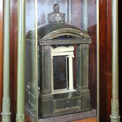 A model demonstrates the classically inspired 'phone box' shape of the Soane family tomb.