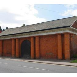 A brick building constructed in the classical style of Paestum