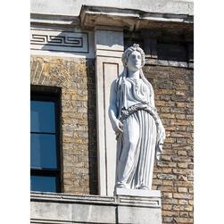 A statue, based on the Greek 'Caryatids' in Athens, high on the facade of the Soane Museum