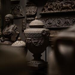 In the Dome area, large Roman cinerary urns are positioned around the perimeter of this eclectic space.