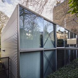 One corner of the front elevation of Hopkins House, showing the two floors of full-height windows.