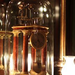An illuminated astronomical clock in the Library Dining Room