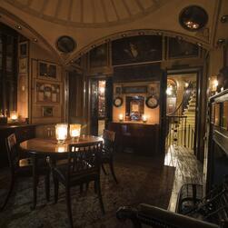 The domed Breakfast Room of no. 13 Lincoln's Inn Fields, lit by candlelight.