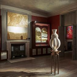 The exhibition gallery at the Museum, centered around an abstract white ceramic sculpture on a golden pedestal.