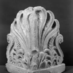 Carved stone ornament featuring an anthemion design with stylized leaves and scrolls.