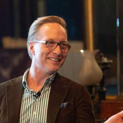 Interior Designer Martin Brudnizki, smiling during his talk at the Soane.