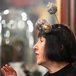 Alice Rawsthorn wearing a headband with disco balls on it.