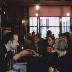 Drinks are served to guests in the Library-Dining Room.