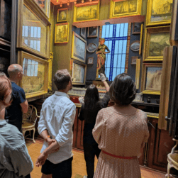 A VA showing a tour group the Nymph's Recess with the South Side Picture Planes open.