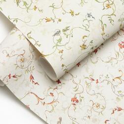 Two overlapping sheets of decorative wallpaper with a delicate floral and vine pattern in soft green, red, and gold tones on a cream background.