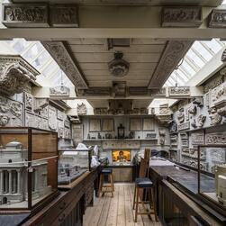 A full width view of the Office, with skylights illuminating the collections on the walls.