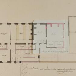 A plan of a building with a flier - a flap of paper that can be lifted up to reveal a different design beneath